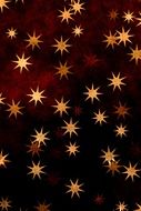 golden, orange, yellow stars at deep brown background