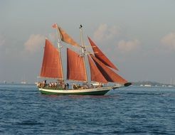 sailboat with red sails