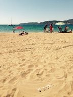 people resting on beach at sea, spain, ibiza