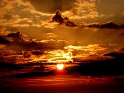 Unusual clouds on the sunset background