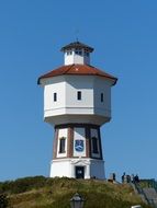 white lighthouse on an island in the North sea