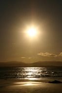 Beach surf at sunset