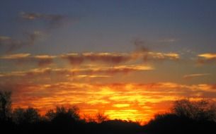 bright orange sunset on the horizon at dusk