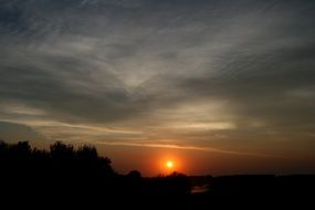 red sunset in the sky on the horizon