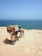 vintage moped on the ocean coast