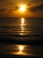 sunset over the sea horizon with waves