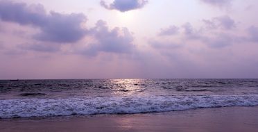 purple sunset over tropical ocean beach