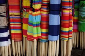 colorful beach screens on wooden sticks