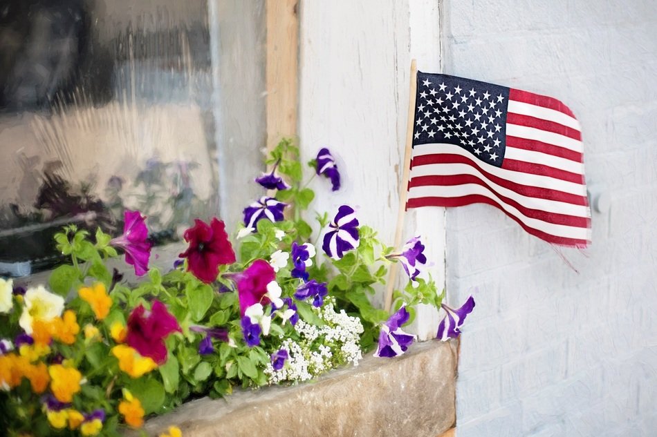 American flag in a flower bed