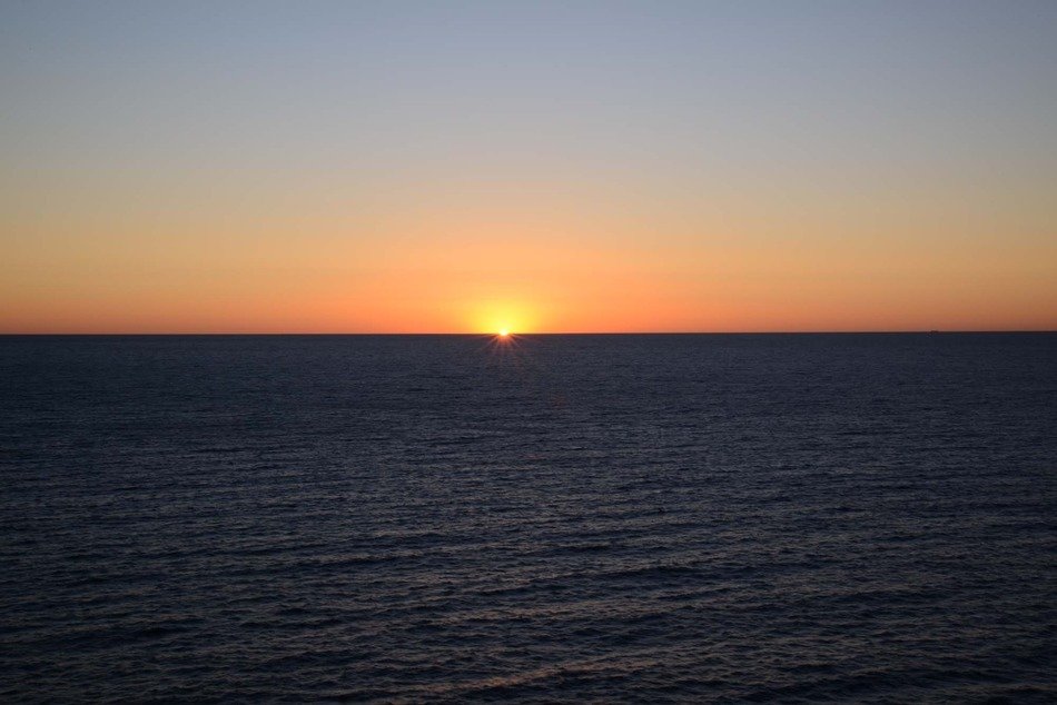 sunrise on a cloudless ocean