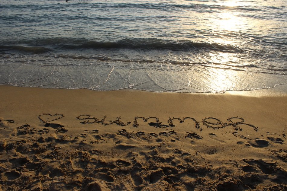 inscription summer on the sandy beach