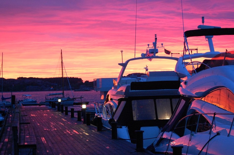 Yachts near the pier on a bright sunset