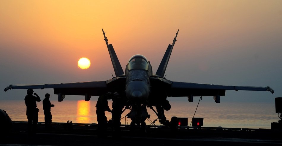 military aircraft at bright sunset