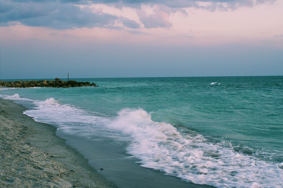 green waves on the shore of the island