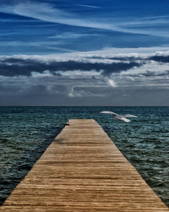 empty wooden bridge to the sea
