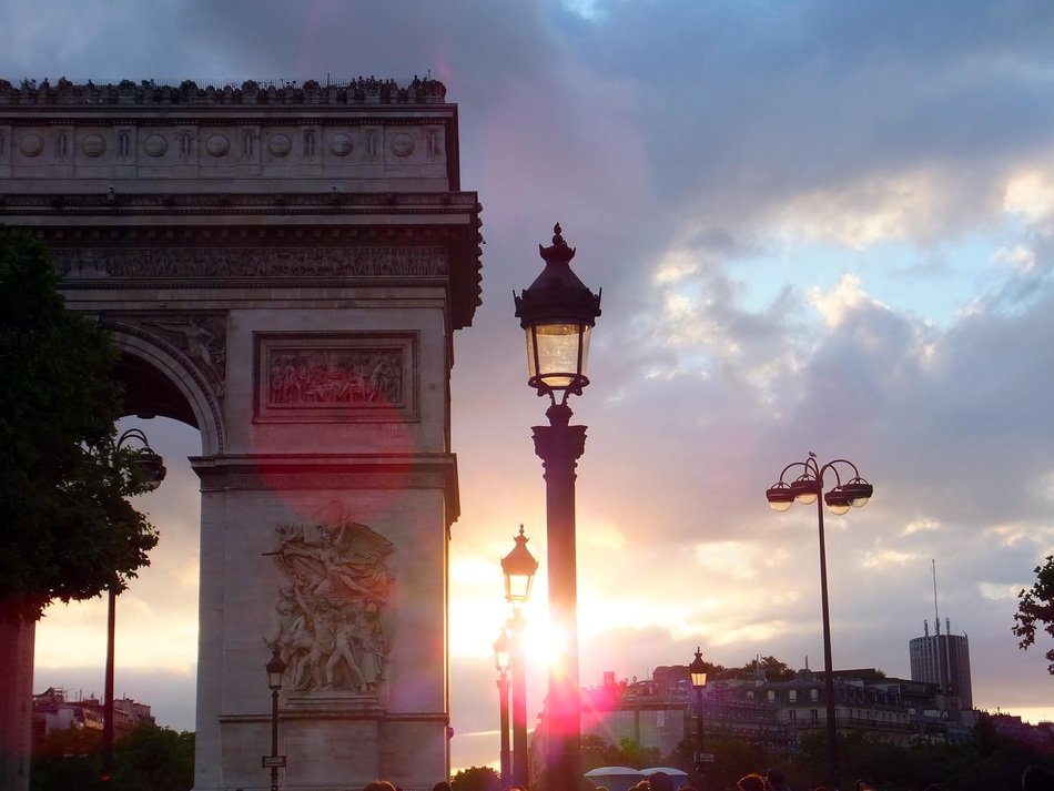 triumphal arch in the bright rays of sunset