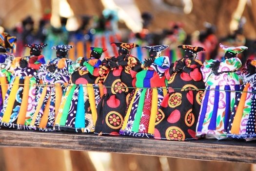 colorful dolls on a table in africa