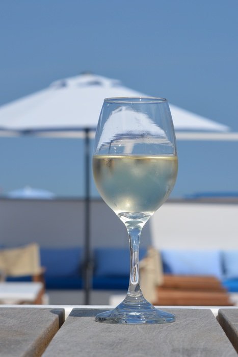 white wine glass in ocean bar