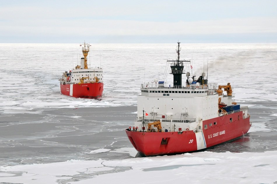 two red icebreakers among the ice