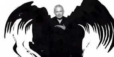 portrait of Jean Paul Gaultier with black wings