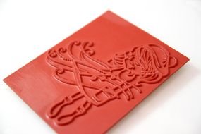 red stamp with a pattern