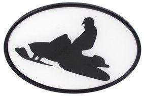 silhouette of a man on a snow scooter