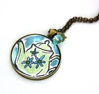 pendant with a pattern in the form of a teapot on a chain