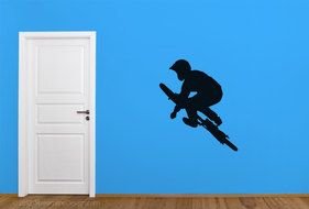 extreme biker silhouette on blue wall