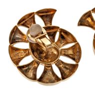 golden greek earrings in graphic representation