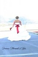 girl in a white dress with a red belt