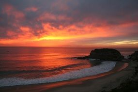 sunset over the calm beach