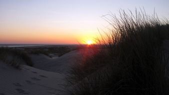 sunset over the dunes in borkum