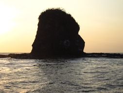 Large rock in ocean