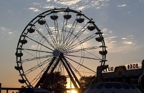 ferris wheel on the fairground in the evening