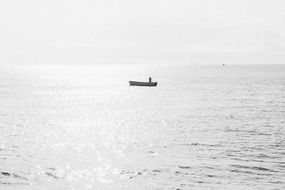 man in boat sea screne