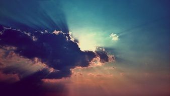 the sun through the dark cloud