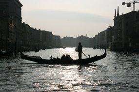 silhouette of a gondolier in venice