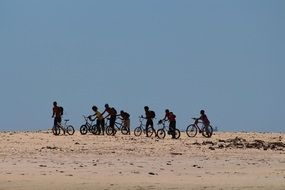 very beautiful children on bicycles