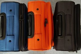 blue, orange and black suitcase