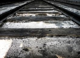 black and white photo of the road for trains