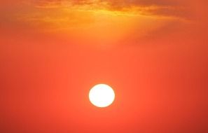 bright sun in the red summer sky