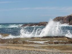 spray of ocean on stone surf