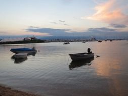 boats on the coast at sunrise