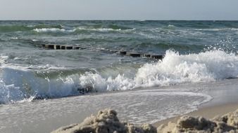 Landscape of rocky and wavy ocean shore