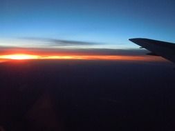 view from the aircraft of the sunset glow