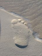 footprint on grey sand