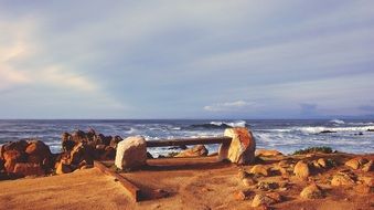 bench on the beach by the ocean