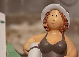 Emmy statuette on the beach on blurred background