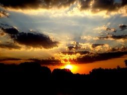 sun are reflected in the clouds at sunset