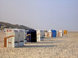 deck chairs on the beach at the North Sea